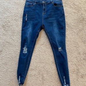 Distressed medium wash skinny jeans